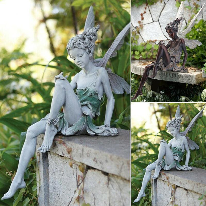"Sittande älva skulptur för trädgård, delikata vingar, ögon stängda, händer på marken, förtrollande och elegant trädgårdsdeko