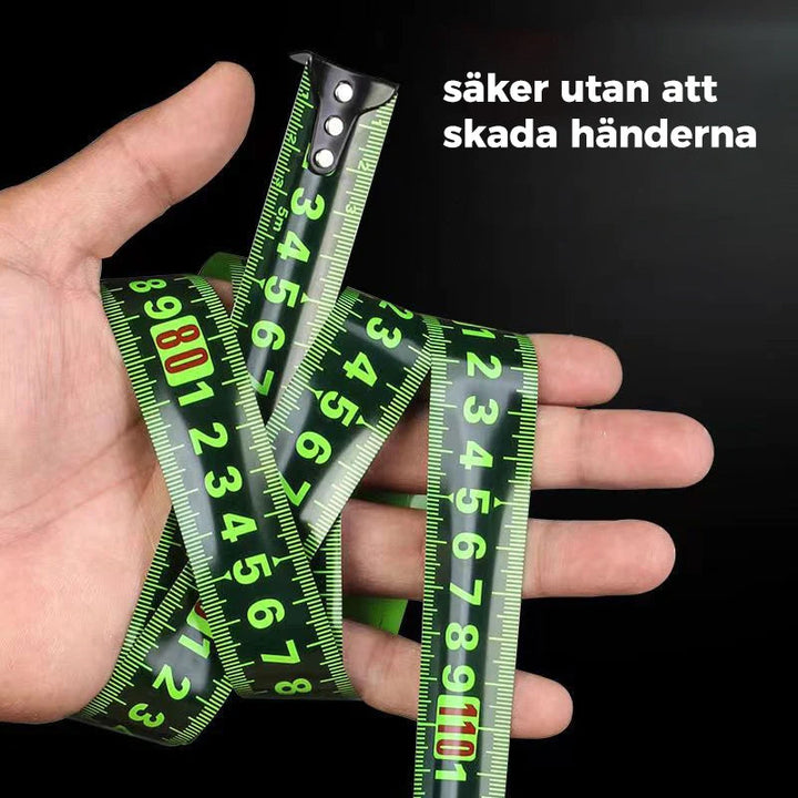 Självlåsande fluorescerande stålmåttband i svart, starkt kolstål med stora synliga siffror, perfekt för precisa mätningar.