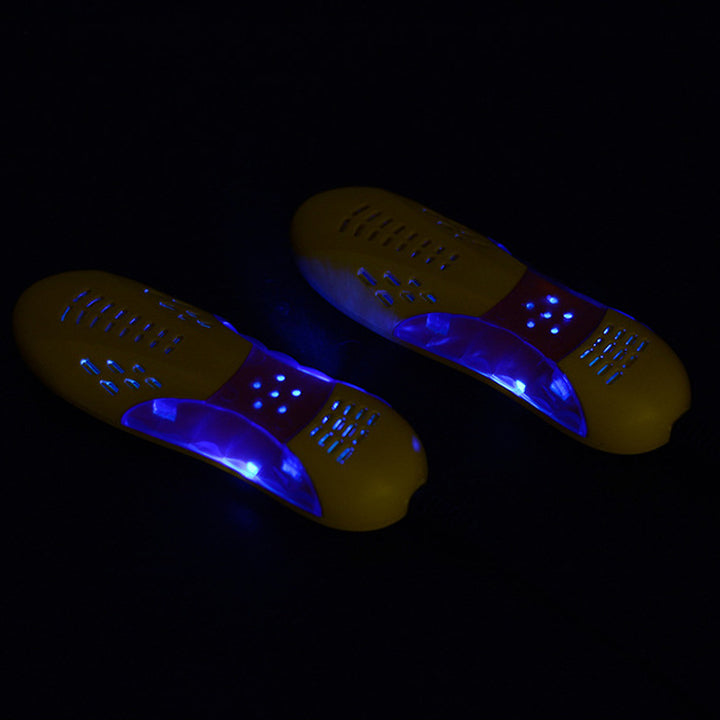 "Skotork med violett ljus, gul plast, kompakt form för effektiv torkning och hygien av skor och handskar."