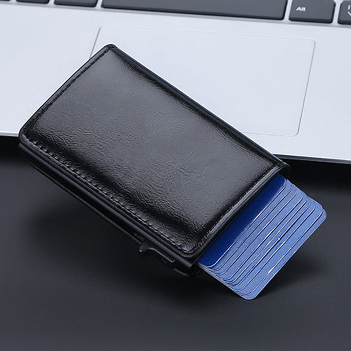 "Slimmad RFID-plånbok i aluminium för män, svart, minimalistisk design med kortplatser och ID-fönster, säker och stilren."