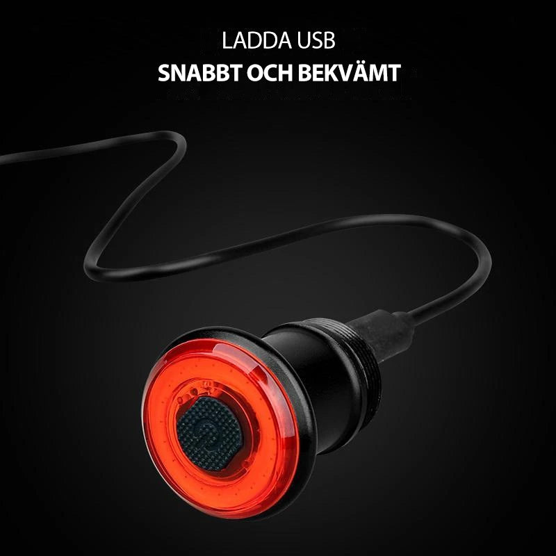 "Smart cykel bakljus med USB-laddning och bromsljus, kompakt design, aluminium, LED, säkerhet för cykling i mörker."