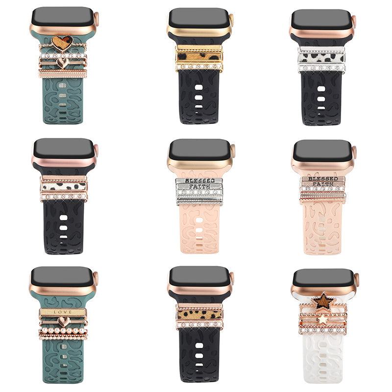 "Smartklockband med dekorativa metallringar i gyllene leopardmönster och roséguldstjärnor, elegant stilaccessoar."
