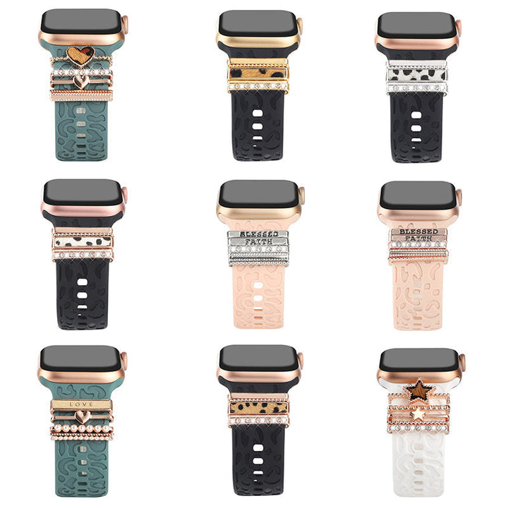 "Smartklockband med dekorativa metallringar i gyllene leopardmönster och roséguldstjärnor, elegant stilaccessoar."