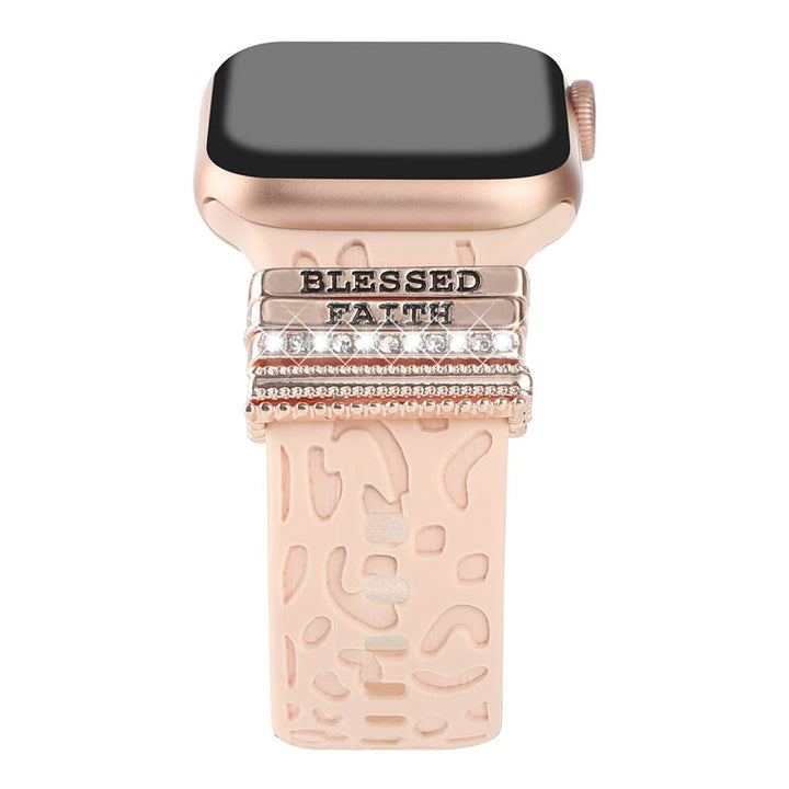 "Smartklockband med dekorativa metallringar i gyllene leopardmönster och roséguldstjärnor, elegant stilaccessoar."