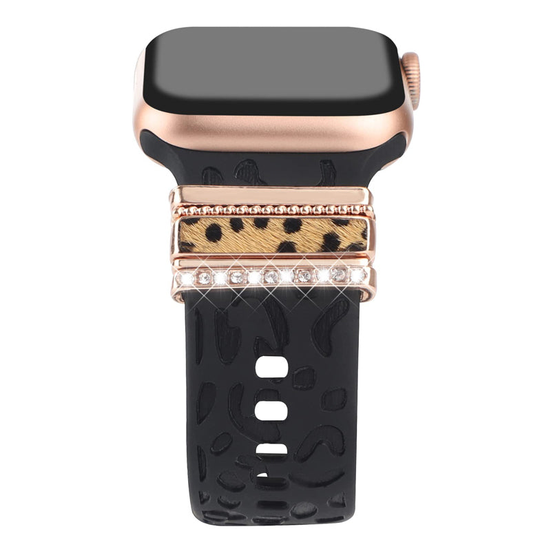 "Smartklockband med dekorativa metallringar i gyllene leopardmönster och roséguldstjärnor, elegant stilaccessoar."