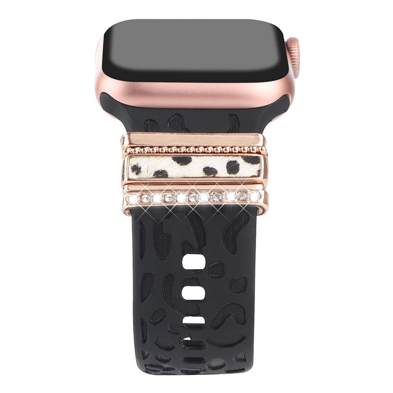 "Smartklockband med dekorativa metallringar i gyllene leopardmönster och roséguldstjärnor, elegant stilaccessoar."