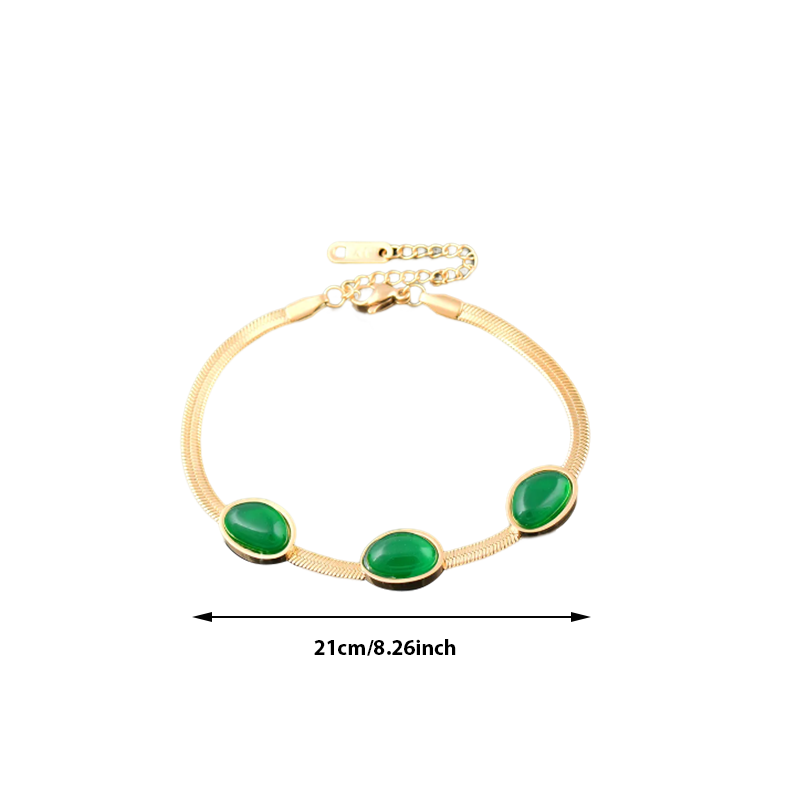 "Smycke i titanstål för kvinnor, smaragdberlock: elegant halsband och armband i grönt för stil och sofistikation."