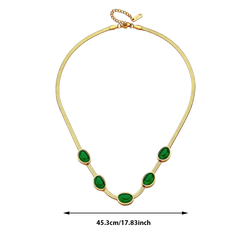 "Smycke i titanstål för kvinnor, smaragdberlock: elegant halsband och armband i grönt för stil och sofistikation."
