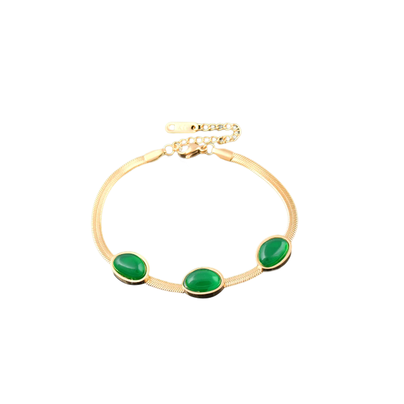 "Smycke i titanstål för kvinnor, smaragdberlock: elegant halsband och armband i grönt för stil och sofistikation."