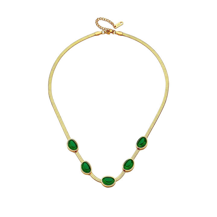 "Smycke i titanstål för kvinnor, smaragdberlock: elegant halsband och armband i grönt för stil och sofistikation."