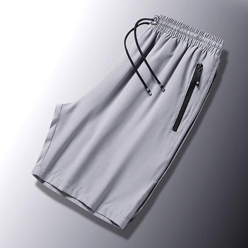 "Snabbtorkande herrshorts för stranden med sportlinjeformad design, fantastisk elasticitet och ventilerande material."