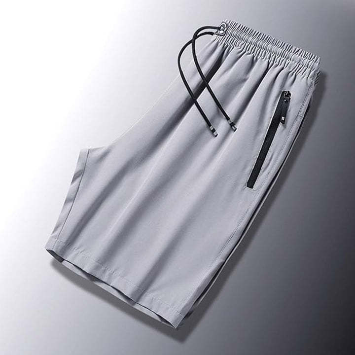 "Snabbtorkande herrshorts för stranden med sportlinjeformad design, fantastisk elasticitet och ventilerande material."