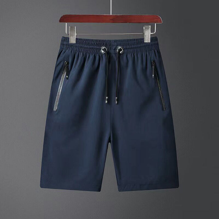 "Snabbtorkande herrshorts för stranden med sportlinjeformad design, fantastisk elasticitet och ventilerande material."