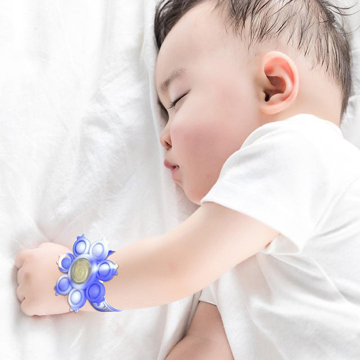 "Snurrande LED-poppande sensoriskt armband i silikon med ljus, perfekt för stil och stresslindring, färgglad och flexibel."