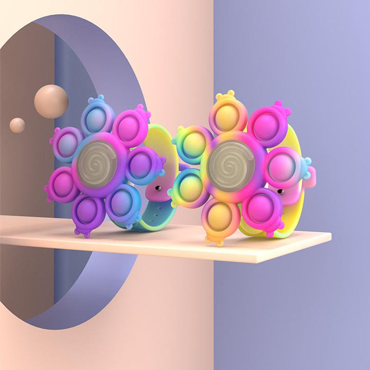 "Snurrande LED-poppande sensoriskt armband i silikon med ljus, perfekt för stil och stresslindring, färgglad och flexibel."