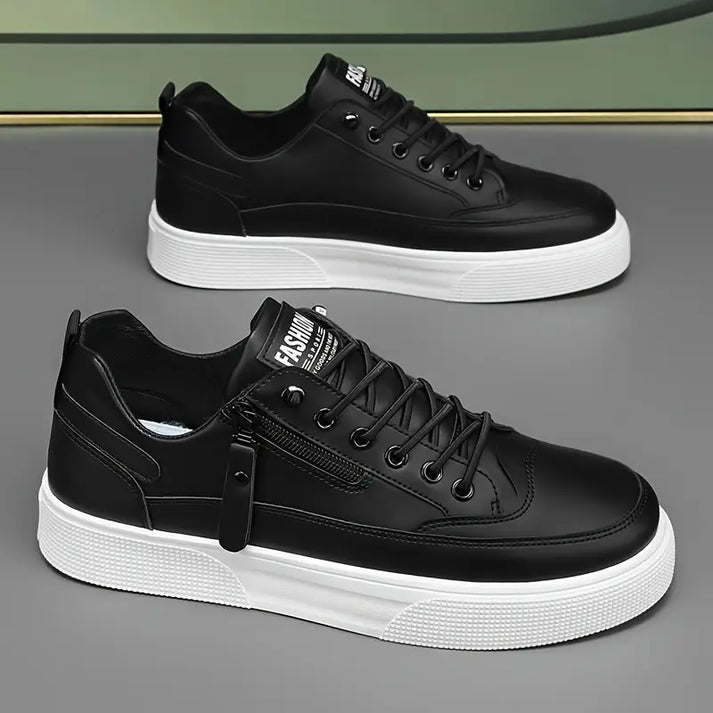 Herrskor sneakers svarta och vita med synlig dragkedja, moderndesignade för vardag och streetwear.