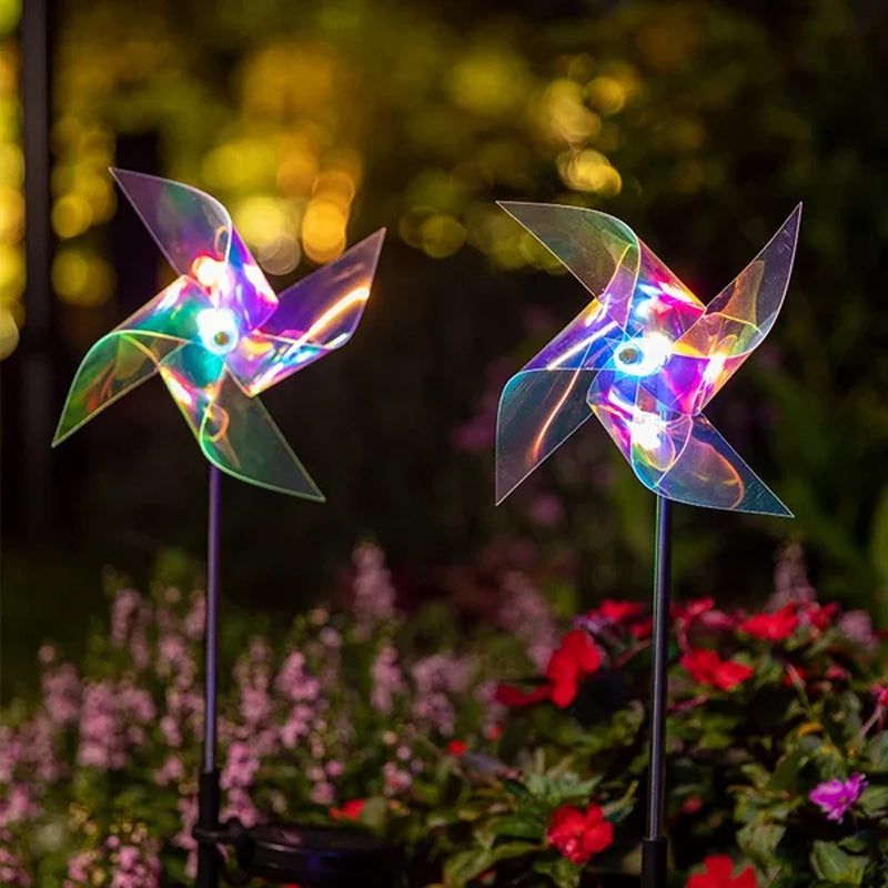 "Sol vinddriven trädgårdslampa som roterar i vinden, med blått ljus och tålig koppartråd, lyser upp natten."
