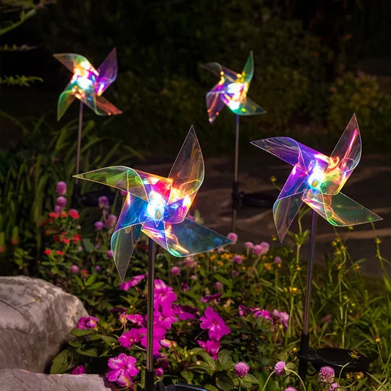 "Sol vinddriven trädgårdslampa som roterar i vinden, med blått ljus och tålig koppartråd, lyser upp natten."
