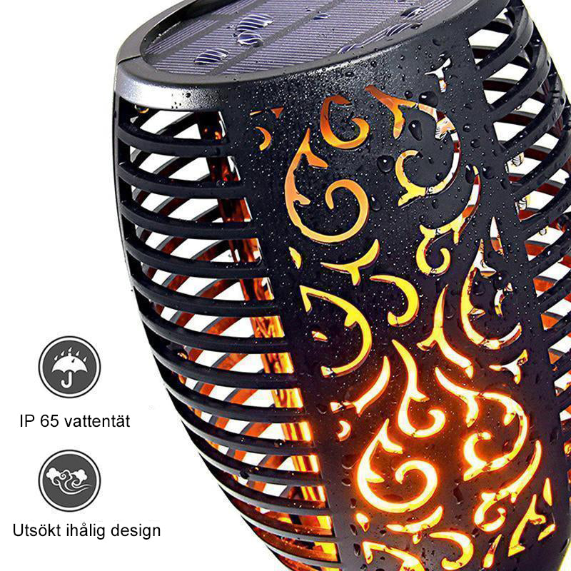 Solcellsdriven LED-bordslampa med flammande ljus, skimrar som naturliga eldflammor; perfekt för atmosfärisk utomhusbelysning.