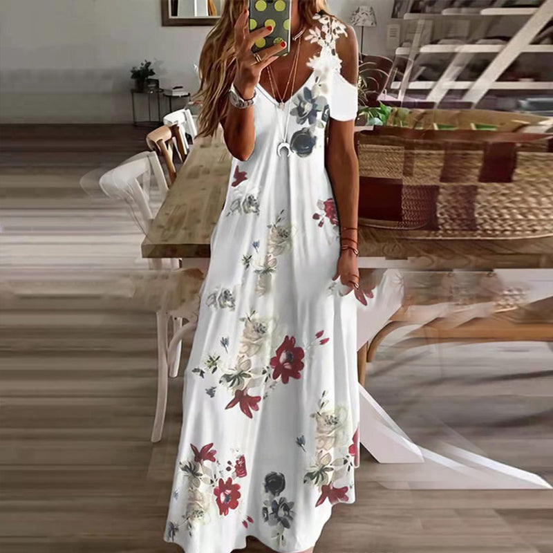 "Sommarklänning för damer, kortärmad med spetsdetaljer, blommigt mönster, maxilängd, feminin och elegant stil."