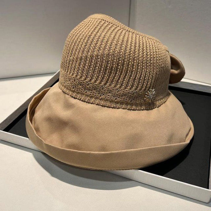 "Sommarmodesolhatt med bredt brätte, gul, UV-skydd, damaccessoarer, elegant, skyddar ansikte mot solen, bärbar design."