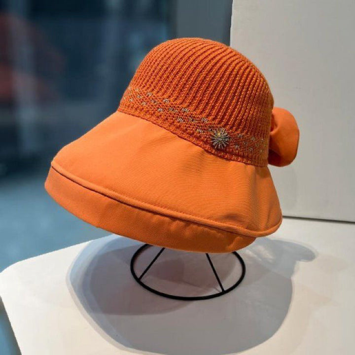 "Sommarmodesolhatt med bredt brätte, gul, UV-skydd, damaccessoarer, elegant, skyddar ansikte mot solen, bärbar design."