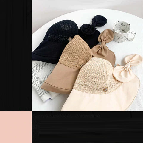 "Sommarmodesolhatt med bredt brätte, gul, UV-skydd, damaccessoarer, elegant, skyddar ansikte mot solen, bärbar design."