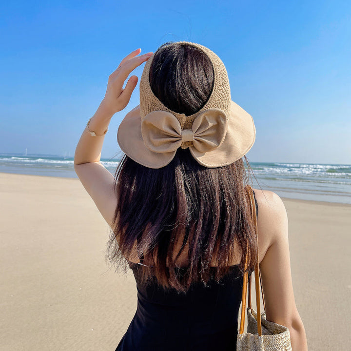 "Sommarmodesolhatt med bredt brätte, gul, UV-skydd, damaccessoarer, elegant, skyddar ansikte mot solen, bärbar design."