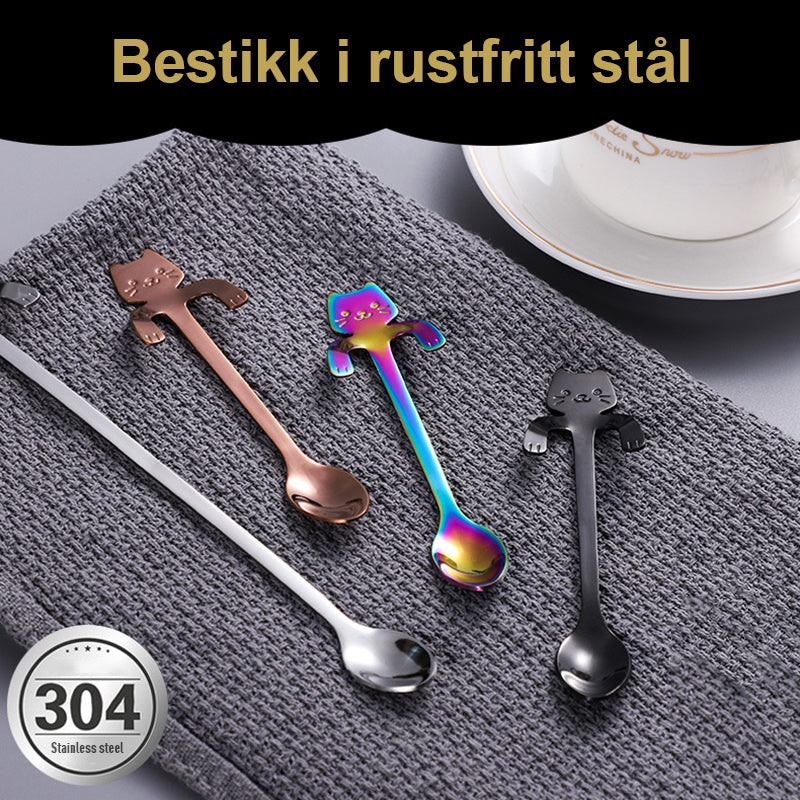 "Söt katt design dessertsked i rostfritt stål, perfekt för hushåll, med flerfärgad, lekfull tecknad kattdesign."