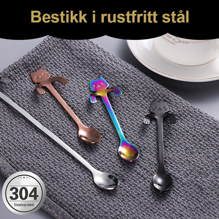 "Söt katt design dessertsked i rostfritt stål, perfekt för hushåll, med flerfärgad, lekfull tecknad kattdesign."