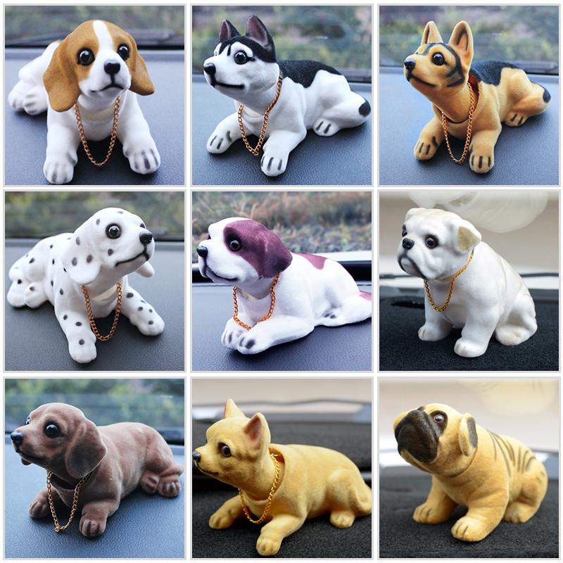 "Söt nickande Noddlehund bildekoration i miljövänligt harts, olika stilar inklusive Beagle och Husky, realistisk design."