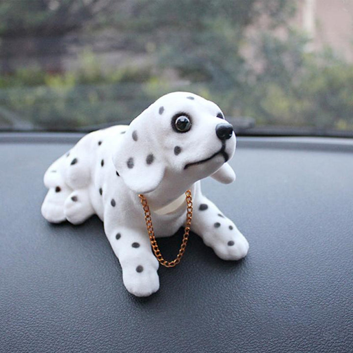"Söt nickande Noddlehund bildekoration i miljövänligt harts, olika stilar inklusive Beagle och Husky, realistisk design."