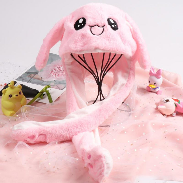 "Söt unisex plysch kaninhatt med hoppande öron, mjuk och inbjudande i olika färger för barn och vuxna."