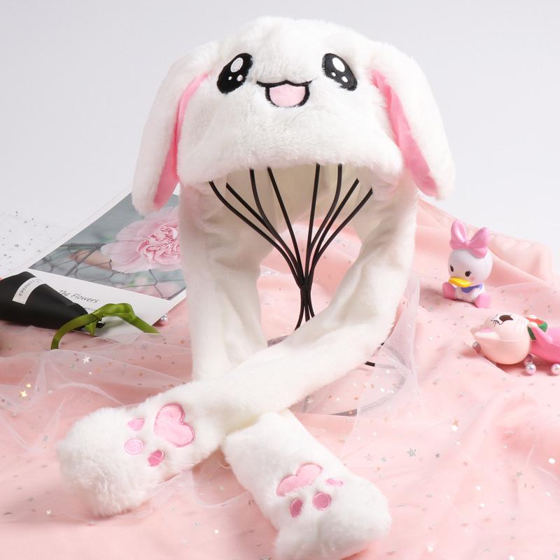 "Söt unisex plysch kaninhatt med hoppande öron, mjuk och inbjudande i olika färger för barn och vuxna."