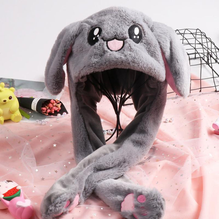 "Söt unisex plysch kaninhatt med hoppande öron, mjuk och inbjudande i olika färger för barn och vuxna."