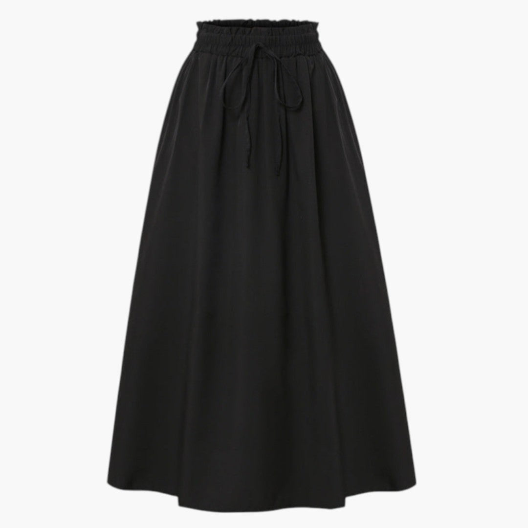 Modern midi kjol för kvinnor med unikt tryckt mönster, A-linjesilhuett och bekväm elastisk midja.
