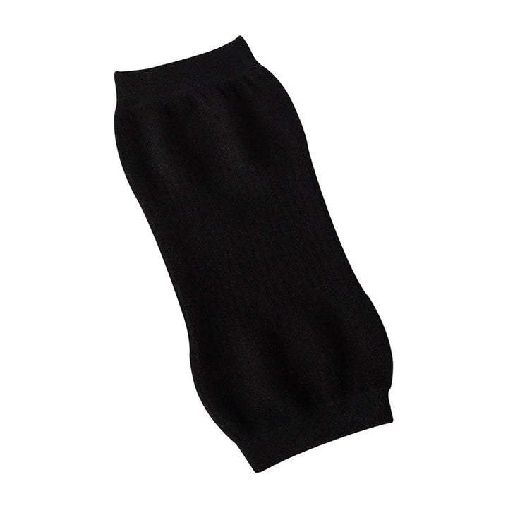 "Stiliga unisex knäskydd i svart kashmir och polyester, idealiska för sport och kyla, erbjuder komfort och värme."