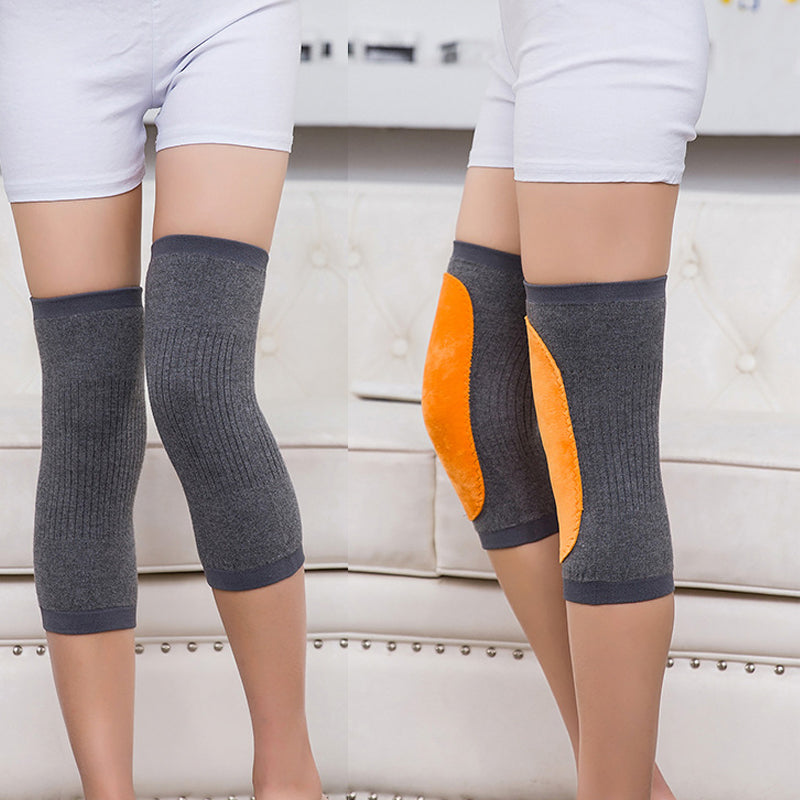 "Stiliga unisex knäskydd i svart kashmir och polyester, idealiska för sport och kyla, erbjuder komfort och värme."