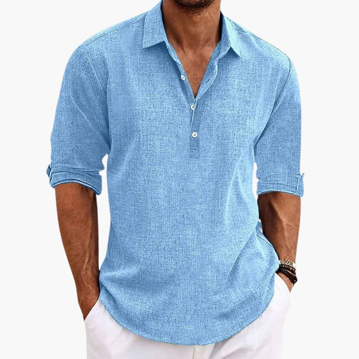 Texturerad herrskjorta i grått med spetsig krage och kort knappslå. Mångsidig långärmad skjorta för herr.