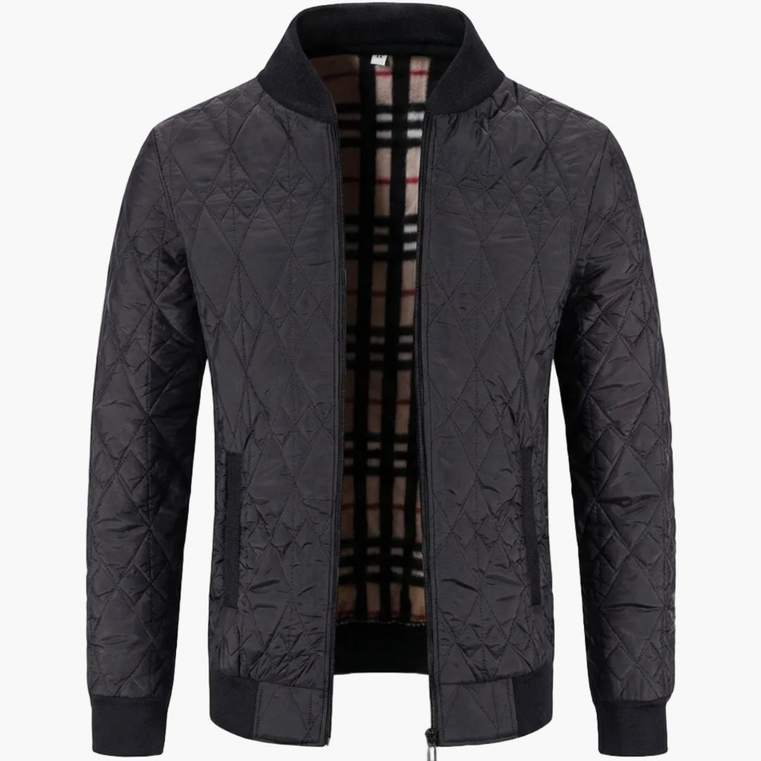 Herrjacka i quiltad design, lätt vadderad för komfort. Ett mångsidigt ytterplagg med dragkedja, stilren för herrkläder.