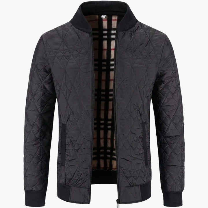 Herrjacka i quiltad design, lätt vadderad för komfort. Ett mångsidigt ytterplagg med dragkedja, stilren för herrkläder.