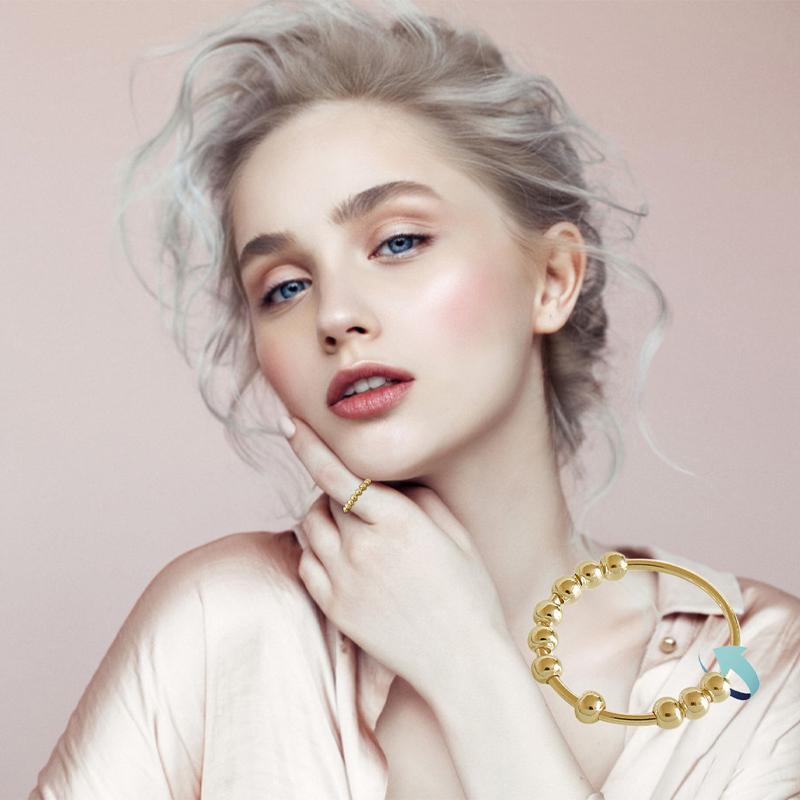 "Stilren Spinner Fidget Ring i silver för stresslindring, med roterande pärlor. Perfekt accessoar för både män och kvinnor."