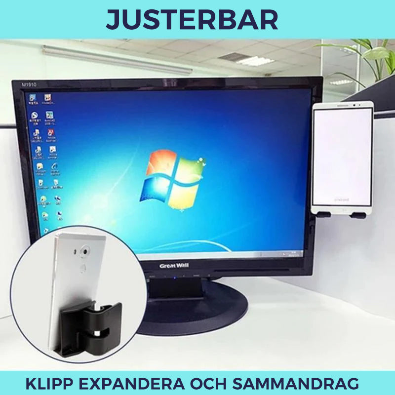 "Stilren svart telefonhållare vid datorskärm, förbättrar interaktion och sparar utrymme, idealisk för smartphones och surfpla