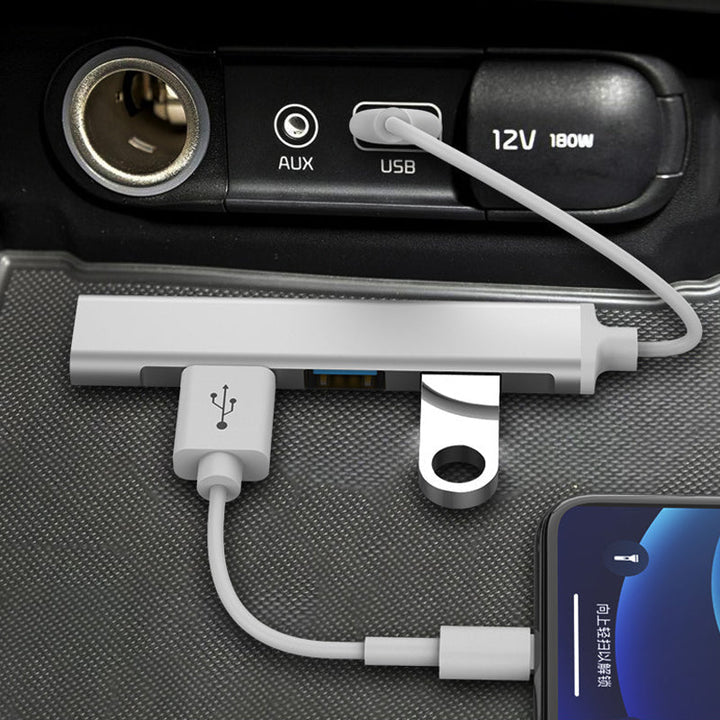 "Stilren USB Typ C HUB i silver med 4 portar för snabb anslutning och höghastighetsöverföring, kompakt och användarvänlig."