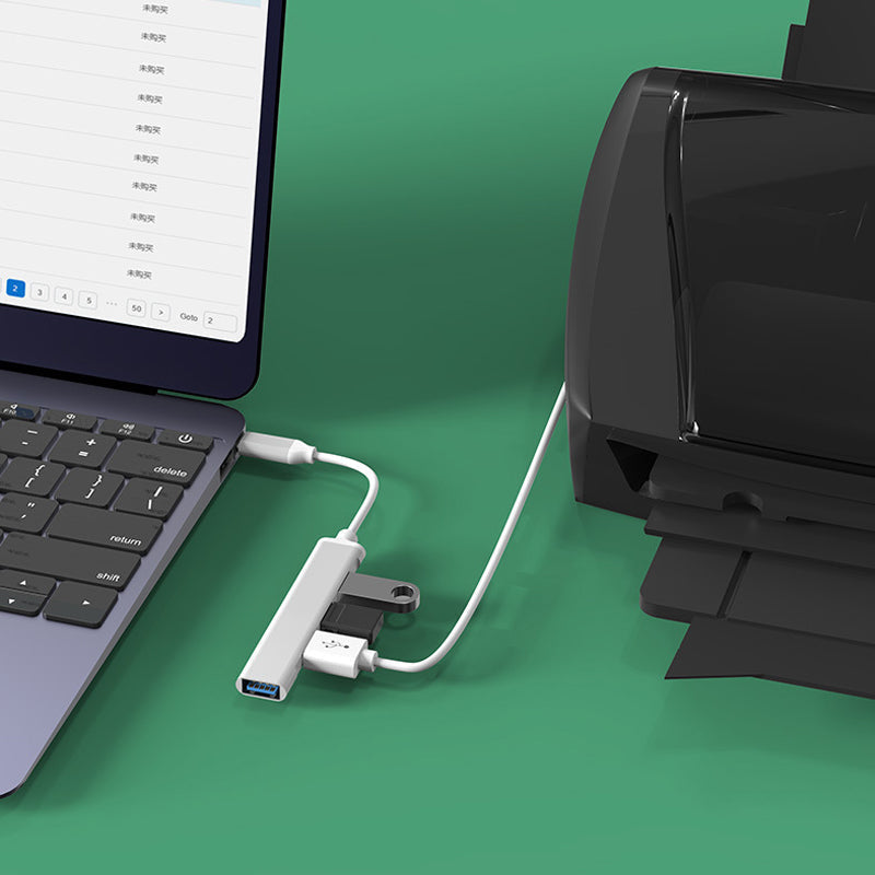 "Stilren USB Typ C HUB i silver med 4 portar för snabb anslutning och höghastighetsöverföring, kompakt och användarvänlig."