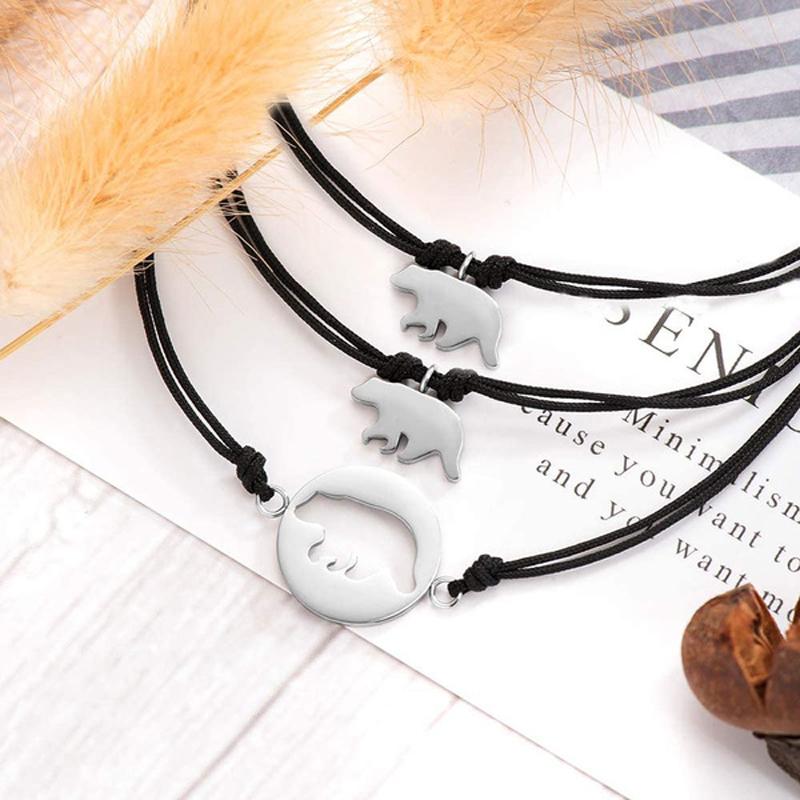 "Stilrena, justerbara armband för kvinnor och barn med meningsfull design i svart och guldtoner."