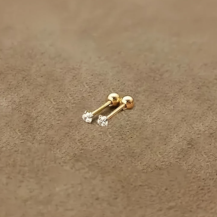 Enkla stilrena örhängen i titanstål med zirkonia. Minimalistiska unisex smycken som är allergivänliga.
