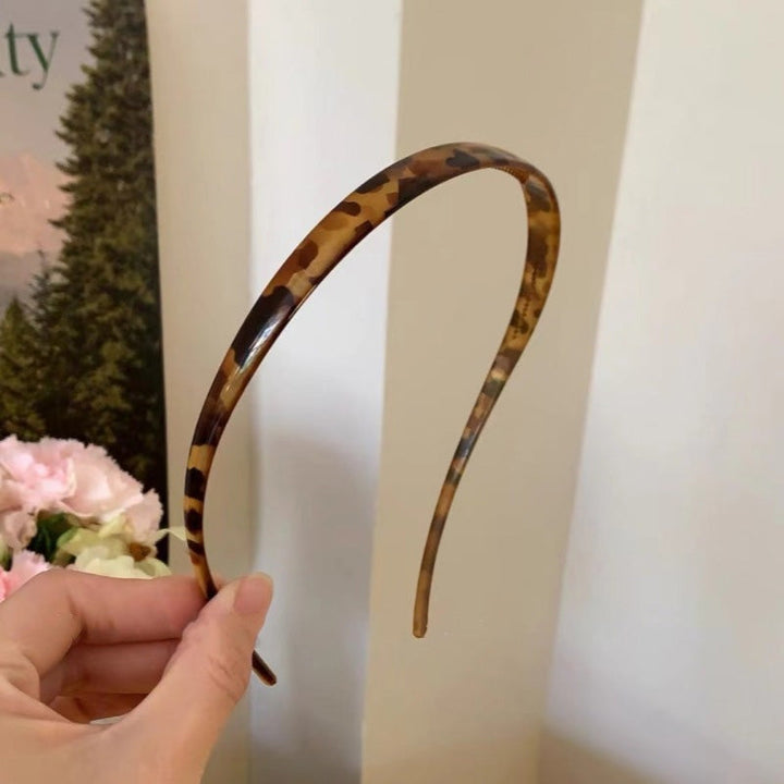 "Stilrent unisex acetatpannband för glasögon, böjt design, perfekt för dag och natt. Accessoar för kvinnor, bekvämt, elegant.