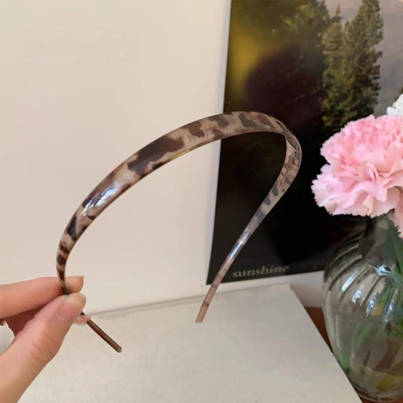 "Stilrent unisex acetatpannband för glasögon, böjt design, perfekt för dag och natt. Accessoar för kvinnor, bekvämt, elegant.