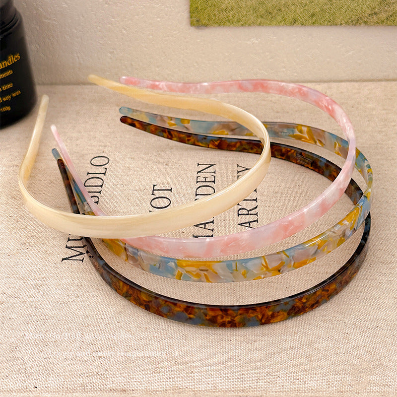 "Stilrent unisex acetatpannband för glasögon, böjt design, perfekt för dag och natt. Accessoar för kvinnor, bekvämt, elegant.